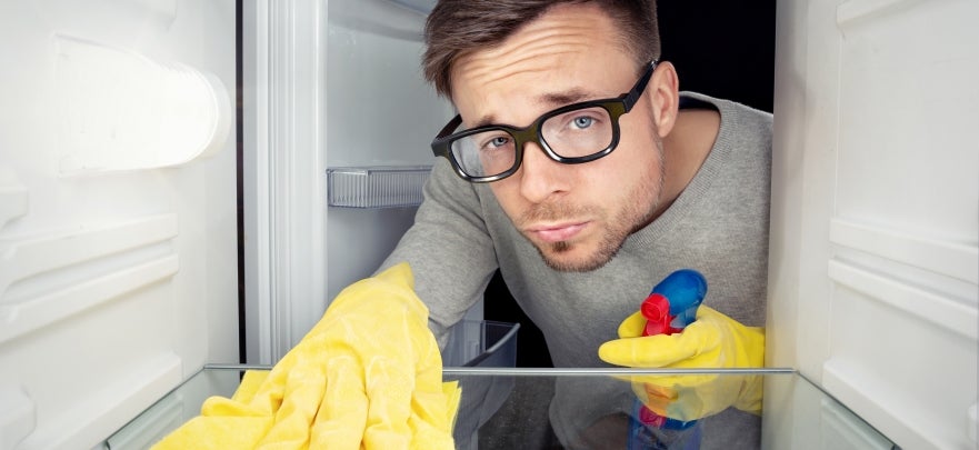 Man Cleaning Fridge